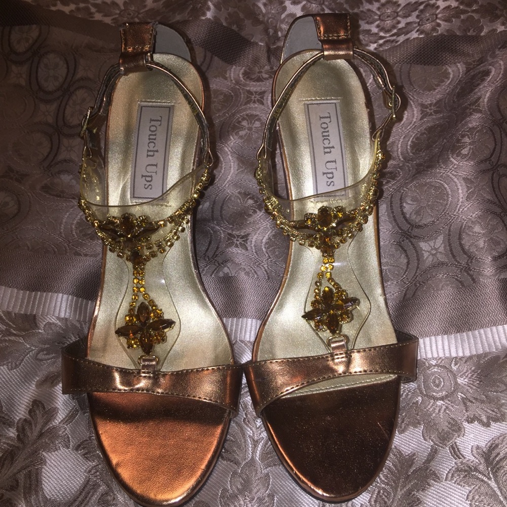 Gold high heels.